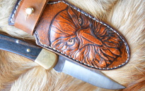 The sheath is handmade from carved leather Condor