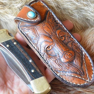 The sheath is carved leather 