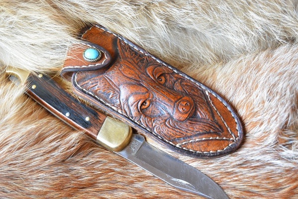 The sheath is carved leather 